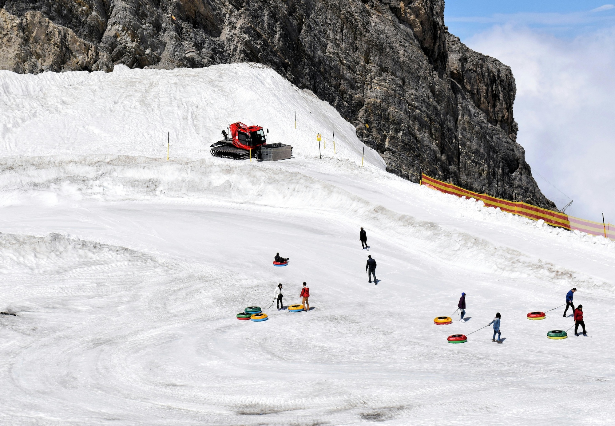 Snow tubing lanes at Soldier Hollow Olympic venue with mountain backdrop