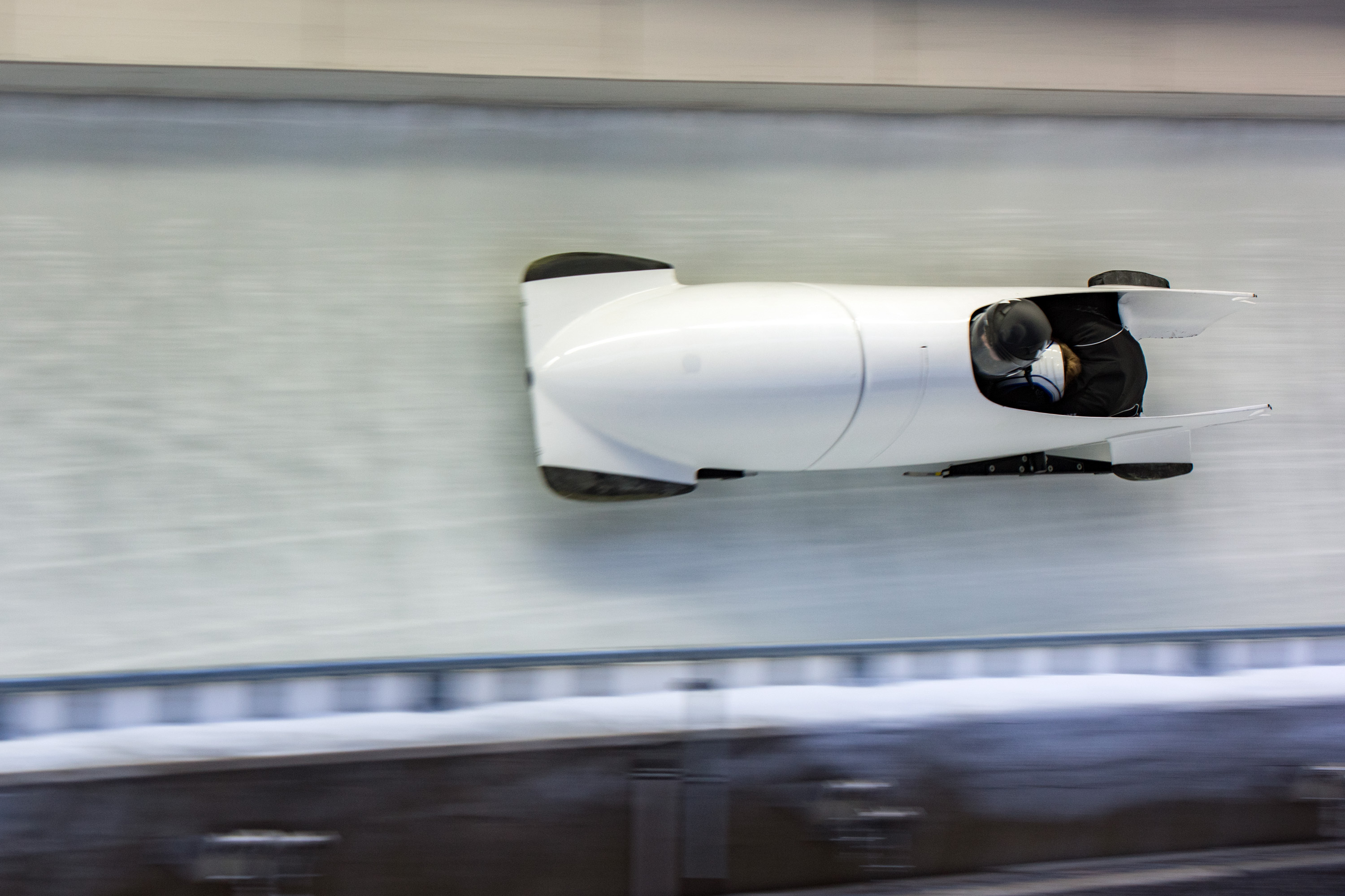 Bobsled speeding down the icy Olympic track at Utah Olympic Park